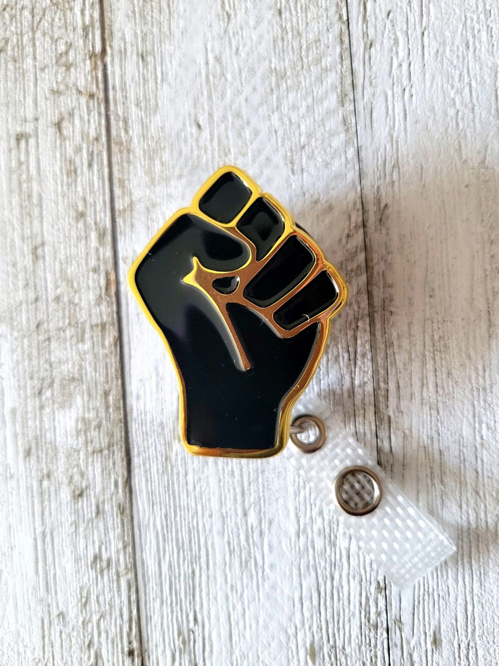 Black and gold power fist